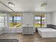 Luxury bathroom with a modern vanity, tub, and serene waterfront views at 18253 Townsend House Rd, Dade City, FL 33523