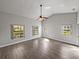 Spacious bedroom with vaulted ceilings, ceiling fan, and natural light at 18253 Townsend House Rd, Dade City, FL 33523