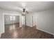 Bedroom featuring wood-look floors, sliding mirrored closet doors, and neutral paint at 18253 Townsend House Rd, Dade City, FL 33523
