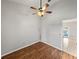 Bedroom featuring hardwood flooring and a ceiling fan at 18253 Townsend House Rd, Dade City, FL 33523