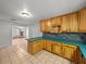 Open kitchen with lots of cabinet space and views into the living room at 18253 Townsend House Rd, Dade City, FL 33523