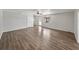 Open living room showcasing wood floors, a fan, and natural light at 18253 Townsend House Rd, Dade City, FL 33523