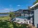 Backyard pool with screened enclosure at 18253 Townsend House Rd, Dade City, FL 33523