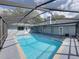 Backyard pool with screened enclosure at 18253 Townsend House Rd, Dade City, FL 33523