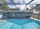Backyard pool with screened enclosure at 18253 Townsend House Rd, Dade City, FL 33523