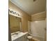 Bathroom with single vanity, mirror, light fixture and shower-tub combo at 18575 Bridle Club Dr # 18575, Tampa, FL 33647
