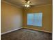 Comfortable bedroom with neutral carpet, ceiling fan, and window with blinds at 18575 Bridle Club Dr # 18575, Tampa, FL 33647