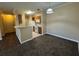 Open kitchen with breakfast bar overlooking the living room, and complete with white appliances at 18575 Bridle Club Dr # 18575, Tampa, FL 33647