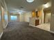 Open concept living room with kitchen, tile floor and breakfast bar at 18575 Bridle Club Dr # 18575, Tampa, FL 33647
