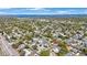 A beautiful residential neighborhood featuring tree-lined streets and well-maintained homes, community lake in distance at 1947 Citrus Hill Ln, Palm Harbor, FL 34683