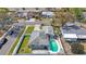 Aerial view of a charming single-Gathering home with a private pool and fenced yard in a lovely neighborhood at 1947 Citrus Hill Ln, Palm Harbor, FL 34683