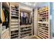 Organized walk-in closet with custom shelving and ample storage for clothes, shoes, and accessories at 1947 Citrus Hill Ln, Palm Harbor, FL 34683
