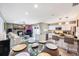 Inviting open-concept living space with a fireplace, modern kitchen, and dining area for seamless entertaining at 1947 Citrus Hill Ln, Palm Harbor, FL 34683