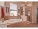 Soaking tub and glass enclosed shower in this bright bathroom at 20220 Autumn Fern Ave, Tampa, FL 33647