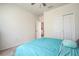 Bright bedroom featuring neutral walls, carpet floors, and a closet for optimal storage at 20220 Autumn Fern Ave, Tampa, FL 33647