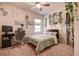 Charming bedroom filled with decorations, desk with computer, and a large window for natural light at 20220 Autumn Fern Ave, Tampa, FL 33647