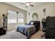 Inviting bedroom with an abundance of natural light, and features an adjacent desk and bookcase at 20220 Autumn Fern Ave, Tampa, FL 33647