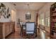 Dining room with decorative shelving and greenery with a view of the adjacent living spaces at 20220 Autumn Fern Ave, Tampa, FL 33647