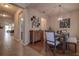 Bright dining room with wood floors, stylish chandelier, modern wall decor, and seating for six at 20220 Autumn Fern Ave, Tampa, FL 33647