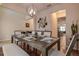 Dining area with seating for eight offering a view of the kitchen and living room at 20220 Autumn Fern Ave, Tampa, FL 33647