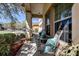 Cozy front porch features comfortable seating, perfect for relaxing and enjoying the neighborhood view at 20220 Autumn Fern Ave, Tampa, FL 33647