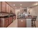 Spacious kitchen featuring stainless steel appliances, wood cabinets, and granite countertops at 20220 Autumn Fern Ave, Tampa, FL 33647
