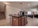 Open kitchen featuring a breakfast bar, tile floor, and wood cabinets at 20220 Autumn Fern Ave, Tampa, FL 33647