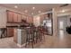 Bright open kitchen featuring a breakfast bar, stainless steel appliances, and wood cabinets at 20220 Autumn Fern Ave, Tampa, FL 33647