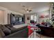 Spacious living room features tile floors, ceiling fan, and large entertainment center at 20220 Autumn Fern Ave, Tampa, FL 33647