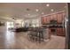 Open-concept living space with bar seating, a large living room, and access to the lanai at 20220 Autumn Fern Ave, Tampa, FL 33647