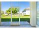 Screened-in back porch with a view of the expansive backyard at 21011 Picasso Ct # 101, Land O Lakes, FL 34637