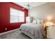 Bright bedroom featuring a ceiling fan, white closet and large window bringing in plenty of natural light at 21011 Picasso Ct # 101, Land O Lakes, FL 34637