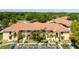 Well-maintained condominium complex with tropical landscaping and ample parking at 21011 Picasso Ct # 101, Land O Lakes, FL 34637
