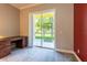 Bright office space with sliding glass door access to lanai and a built in desk at 21011 Picasso Ct # 101, Land O Lakes, FL 34637