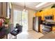 Modern kitchen with stainless steel appliances, granite countertops, and a breakfast bar at 21011 Picasso Ct # 101, Land O Lakes, FL 34637
