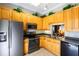 Well-equipped kitchen featuring stainless steel appliances and stylish cabinets for a modern cooking experience at 21011 Picasso Ct # 101, Land O Lakes, FL 34637