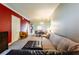 Spacious living room with plush seating, neutral carpet, and a glimpse into dining area at 21011 Picasso Ct # 101, Land O Lakes, FL 34637