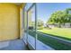 View from screened patio of expansive backyard featuring lush green grass and mature trees at 21011 Picasso Ct # 101, Land O Lakes, FL 34637
