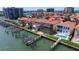 Waterfront homes boast screened-in pools, boat docks, and easy access to the bay at 218 Sand Key Estates Dr, Clearwater Beach, FL 33767