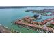 A waterfront community featuring residences with private boat docks and a view of the open water at 218 Sand Key Estates Dr, Clearwater Beach, FL 33767