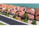 Aerial view of waterfront homes showing well manicured lawns and mature landscaping at 218 Sand Key Estates Dr, Clearwater Beach, FL 33767