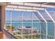 Balcony view of the open bay, private dock and boat lift from this home at 218 Sand Key Estates Dr, Clearwater Beach, FL 33767