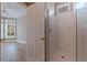Bathroom featuring tiled shower with glass door and neutral walls at 218 Sand Key Estates Dr, Clearwater Beach, FL 33767