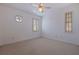 Simple bedroom featuring neutral carpet, bright white walls and woodwork and windows with wood shutter blinds at 218 Sand Key Estates Dr, Clearwater Beach, FL 33767