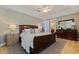 Spacious bedroom with a large bed, dresser, and bedside table, offering a relaxing retreat at 218 Sand Key Estates Dr, Clearwater Beach, FL 33767