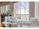 Bright breakfast nook featuring large windows with waterfront views and casual seating at 218 Sand Key Estates Dr, Clearwater Beach, FL 33767