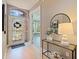 Inviting entryway features a decorative glass door and a console table with stylish decor at 218 Sand Key Estates Dr, Clearwater Beach, FL 33767