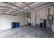 Spacious two car garage with white cinder block wall and lots of extra storage space at 218 Sand Key Estates Dr, Clearwater Beach, FL 33767