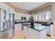Well-equipped kitchen features stainless appliances, a kitchen island and sleek countertops at 218 Sand Key Estates Dr, Clearwater Beach, FL 33767
