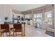 The bright kitchen has stainless steel appliances, an island, and waterfront views at 218 Sand Key Estates Dr, Clearwater Beach, FL 33767